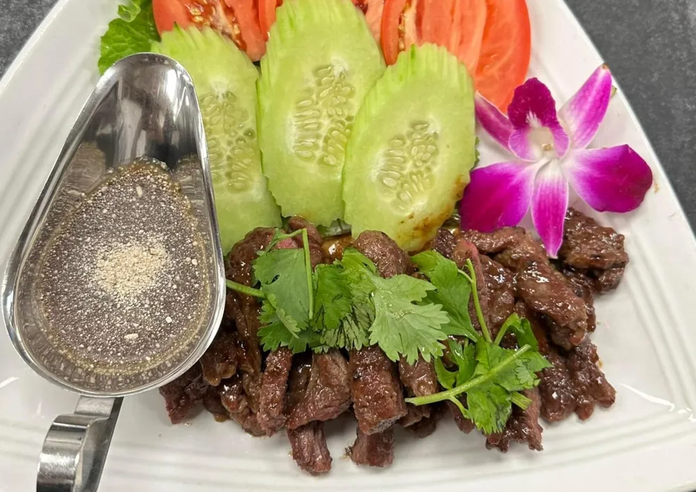 Grilled beef with fresh cucumber, tomato and dipping sauce at Thai Spoon
